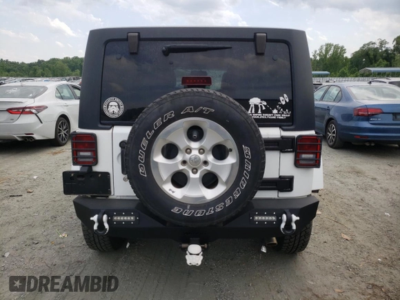 2013 Jeep Wrangler Unlimited Sahara with VIN 1C4HJWEG9DL628684, listed as a Copart auction lot 57672175 with 69,010 mi miles and Salvage title. Bid and sale history available at DreamBid. Image 6.