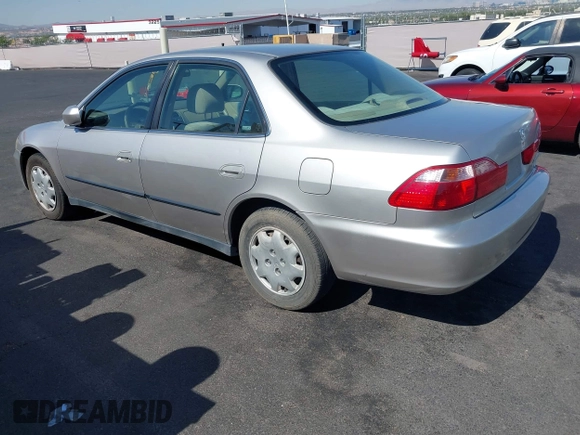 1999 Honda Accord LX with VIN JHMCG6650XC011621, listed as a IAAI auction lot 42401527 with 243,227 mi miles and . Bid and sale history available at DreamBid. Image 3.