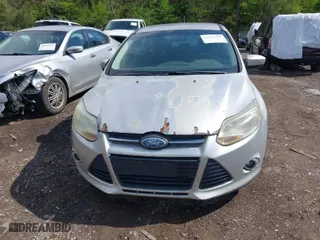 2012 Ford Focus SE with VIN 1FAHP3F22CL115877, listed as a IAAI auction lot 42031223 with 138,743 mi miles. Bid and sale history available at carsss.com. Image 6.