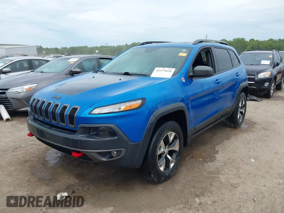 2017 Jeep Cherokee Trailhawk with VIN 1C4PJMBS2HW612792, listed as a IAAI auction lot 42373828 with 74,106 mi miles and . Bid and sale history available at DreamBid. Image 2.