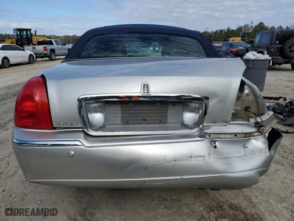 2003 Lincoln Town Car Cartier with VIN 1LNHM83W23Y639990, listed as a Copart auction lot 85591924 with 124,515 mi miles and Salvage Title. Bid and sale history available at carsss.com. Image 6.