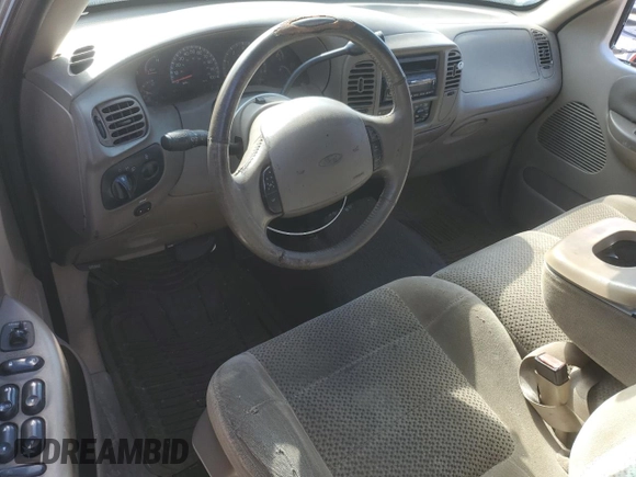 2002 Ford F-150 XLT with VIN 1FTRW07L22KB89313, listed as a Copart auction lot 76680834 with 377,443 mi miles and Salvage Title. Bid and sale history available at DreamBid. Image 8.