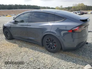 2016 Tesla Model X 70D z VIN 5YJXCBE23GF005295, wystawiony jako Copart lot #51034005 z przebiegiem 130 325 mil mil oraz Szkody całkowita. Historia ofert i sprzedaży dostępna na DreamBid. Obrazek 2.