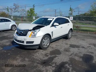 2013 Cadillac SRX Luxury Collection with VIN 3GYFNCE33DS608040, listed as a IAAI auction lot 41912860 with 128,295 mi miles and . Bid and sale history available at DreamBid. Image 2.