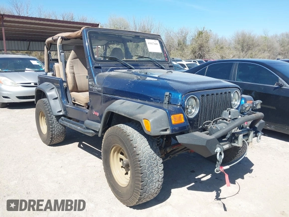 2000 Jeep Wrangler Sport with VIN 1J4FA49S0YP770943, listed as a IAAI auction lot 41817600 with 165,379 mi miles and . Bid and sale history available at DreamBid. Image 1.