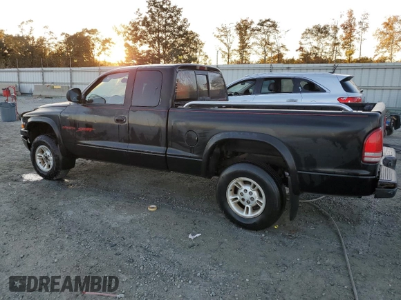 1999 Dodge Dakota SLT with VIN 1B7GG22X1XS235134, listed as a Copart auction lot 77482224 with 172,701 mi miles and Salvage Title. Bid and sale history available at carsss.com. Image 2.