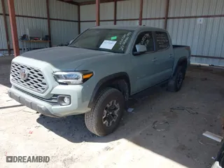 2023 Toyota Tacoma 4WD SR with VIN 3TMCZ5ANXPM613857, listed as a IAAI auction lot 41771957 with 76,232 mi miles. Bid and sale history available at carsss.com. Image 2.