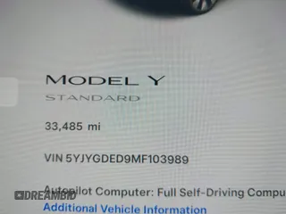2021 Tesla Model Y Standard Range with VIN 5YJYGDED9MF103989, listed as a IAAI auction lot 41482268 with 33,485 mi miles and . Bid and sale history available at DreamBid. Image 9.