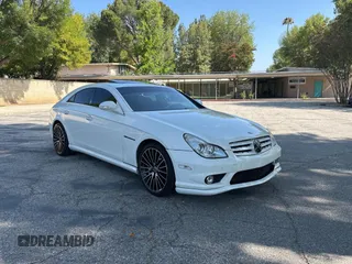 2006 Mercedes-Benz CLS 55 AMG with VIN WDDDJ76X66A014683, listed as a Copart auction lot 65393595 with 99,430 mi miles and Salvage title. Bid and sale history available at DreamBid. Image 1.