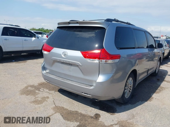 2011 Toyota Sienna XLE AAS with VIN 5TDYK3DC3BS007690, listed as a IAAI auction lot 42044640 with 253,359 mi miles. Bid and sale history available at carsss.com. Image 4.