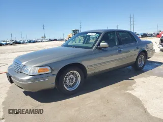 2001 Ford Crown Victoria LX z VIN 2FAFP74W41X150327, wystawiony jako Copart lot #48576565 z przebiegiem 74 081 mil mil oraz Szkoda całkowita • Salvage title. Historia ofert i sprzedaży dostępna na DreamBid. Obrazek 1.