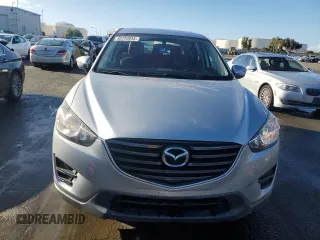 2016 Mazda CX-5 Sport with VIN JM3KE2BEXG0904597, listed as a Copart auction lot 86293834 with 63,343 mi miles and Salvage Title. Bid and sale history available at carsss.com. Image 5.