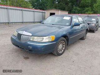 2002 Lincoln Town Car Sig. with VIN 1LNHM82W12Y665626, listed as a IAAI auction lot 42041230 with 1 mi miles. Bid and sale history available at carsss.com. Image 2.