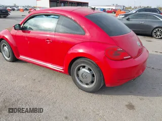 2012 Volkswagen Beetle 2.5L PZEV with VIN 3VWJP7AT0CM641164, listed as a IAAI auction lot 40698387 with 113,200 mi miles. Bid and sale history available at carsss.com. Image 3.