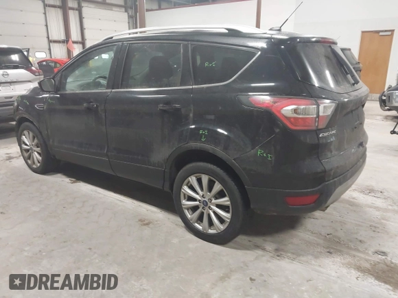 2017 Ford Escape Titanium with VIN 1FMCU9J9XHUB51401, listed as a IAAI auction lot 41025642 with 77,908 mi miles. Bid and sale history available at carsss.com. Image 3.