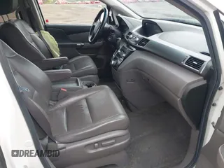 2013 Honda Odyssey Touring with VIN 5FNRL5H99DB041328, listed as a IAAI auction lot 41797520 with 148,523 mi miles and . Bid and sale history available at carsss.com. Image 5.