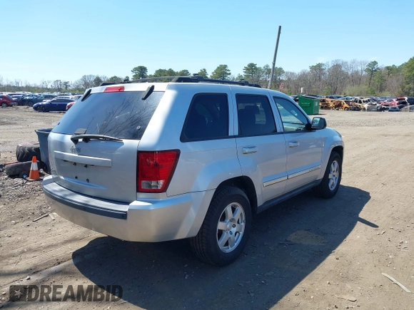 2010 Jeep Grand Cherokee Laredo with VIN 1J4PR4GKXAC141526, listed as a IAAI auction lot 41997559 with 0 mi miles. Bid and sale history available at carsss.com. Image 4.