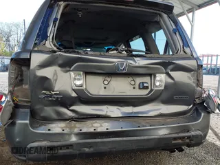 2007 Honda Pilot EX-L with VIN 5FNYF18777B012649, listed as a IAAI auction lot 42070873 with 167,419 mi miles and . Bid and sale history available at DreamBid. Image 6.