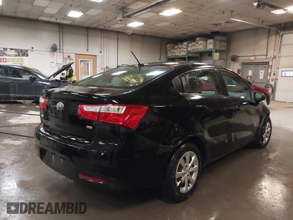 2014 Kia Rio LX with VIN KNADM4A31E6404206, listed as a IAAI auction lot 41543090 with 70,563 mi miles and . Bid and sale history available at DreamBid. Image 4.