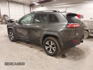 2014 Jeep Cherokee Trailhawk with VIN 1C4PJMBS2EW231813, listed as a IAAI auction lot 41664287 with 128,893 mi miles. Bid and sale history available at carsss.com. Image 3.