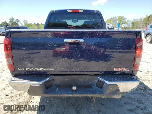 2012 GMC Canyon SLE1 with VIN 1GTD5MF98C8150458, listed as a Copart auction lot 52250445 with 63,100 mi miles and Salvage Title. Bid and sale history available at carsss.com. Image 6.