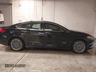 2017 Ford Fusion Titanium with VIN 3FA6P0SUXHR208653, listed as a IAAI auction lot 41312067 with 62,601 mi miles and . Bid and sale history available at DreamBid. Image 13.
