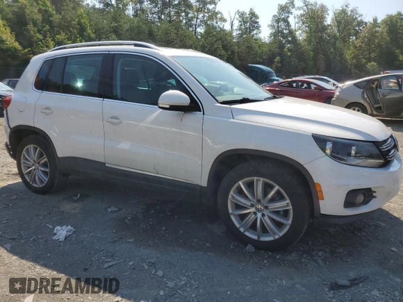 2012 Volkswagen Tiguan SEL with VIN WVGAV7AX0CW535644, listed as a Copart auction lot 54335534 with 156,079 mi miles and Salvage Title. Bid and sale history available at DreamBid. Image 4.