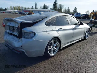 2016 BMW 4 Series 428i xDrive with VIN WBA4C9C5XGG135893, listed as a IAAI auction lot 41976541 with 86,987 mi miles and . Bid and sale history available at carsss.com. Image 4.