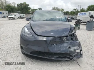 2024 Tesla Model Y Long Range с VIN 7SAYGDEE7RA279293, выставлен на аукционе Copart как лот 62758065 с пробегом 23 271 миль миль и Списание • Salvage title. История ставок и продаж доступна на DreamBid. Изображение 5.