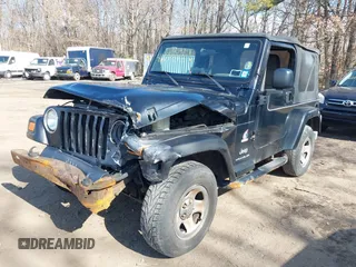 2003 Jeep Wrangler X with VIN 1J4FA39S53P362991, listed as a IAAI auction lot 41607212 with 240,556 mi miles. Bid and sale history available at carsss.com. Image 6.