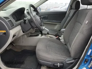 2005 Kia Spectra with VIN KNAFE161955108612, listed as a Copart auction lot 79648514 with 156,963 mi miles and Salvage Title. Bid and sale history available at carsss.com. Image 7.