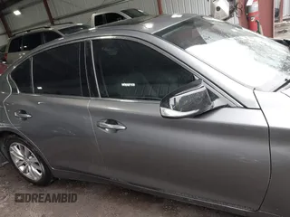 2015 Infiniti Q50 Premium z VIN JN1BV7ARXFM411040, wystawiony jako IAAI lot #41706295 z przebiegiem 97 297 mil mil oraz . Historia ofert i sprzedaży dostępna na DreamBid. Obrazek 13.