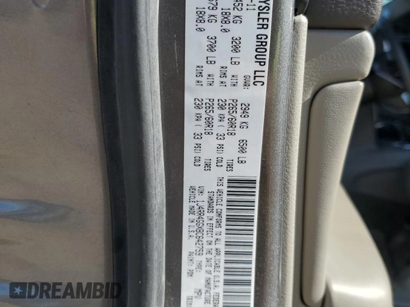 2011 Jeep Grand Cherokee Laredo with VIN 1J4RR4GGXBC642759, listed as a Copart auction lot 55767575 with 144,104 mi miles and Salvage title. Bid and sale history available at DreamBid. Image 12.