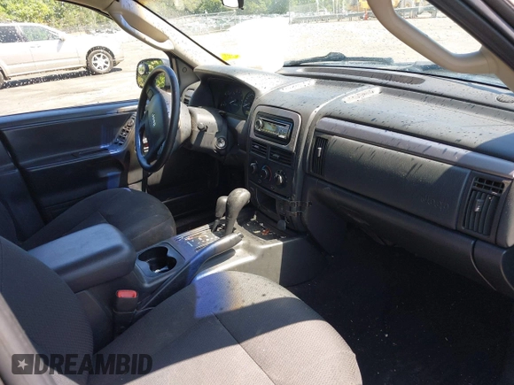 2004 Jeep Grand Cherokee Laredo z VIN 1J4GW48S44C204714, wystawiony jako IAAI lot #42137857 z przebiegiem 251 591 mil mil oraz . Historia ofert i sprzedaży dostępna na DreamBid. Obrazek 5.
