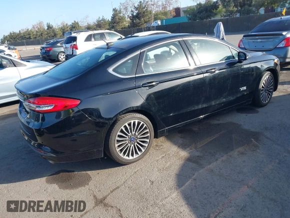 2017 Ford Fusion Energi SE with VIN 3FA6P0PU0HR129792, listed as a IAAI auction lot 41104376 with 86,659 mi miles. Bid and sale history available at carsss.com. Image 4.