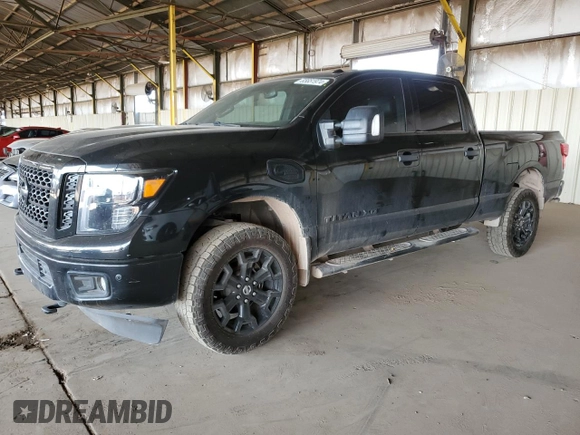 2019 Nissan Titan XD SL with VIN 1N6BA1F47KN534864, listed as a Copart auction lot 65651974 with 79,230 mi miles and Salvage Title. Bid and sale history available at carsss.com. Image 1.
