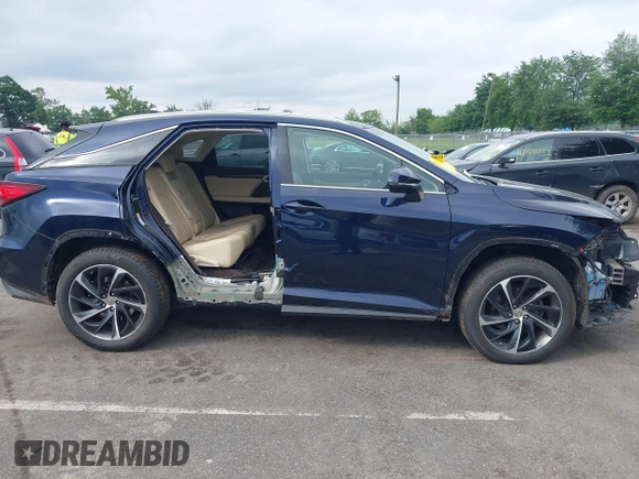 2016 Lexus RX 350 with VIN 2T2BZMCA0GC001767, listed as a IAAI auction lot 42571629 with 84,041 mi miles and . Bid and sale history available at DreamBid. Image 13.