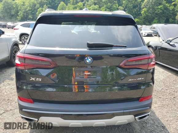 2023 BMW X5 xDrive45e z VIN 5UXTA6C09P9R00571, wystawiony jako Copart lot #61052995 z przebiegiem 9 702 mil mil oraz Szkoda całkowita • Salvage title. Historia ofert i sprzedaży dostępna na DreamBid. Obrazek 6.