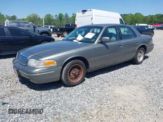 1999 Ford Crown Victoria LX с VIN 2FAFP74W8XX160853, выставлен на аукционе IAAI как лот 41987108 с пробегом 100 582 миль миль и . История ставок и продаж доступна на DreamBid. Изображение 2.