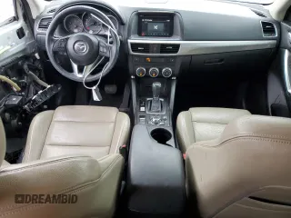 2016 Mazda CX-5 Touring z VIN JM3KE2CY5G0849288, wystawiony jako Copart lot #54594545 z przebiegiem 90 882 mil mil oraz Szkoda całkowita • Salvage title. Historia ofert i sprzedaży dostępna na DreamBid. Obrazek 8.
