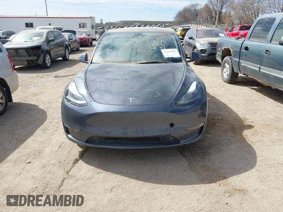 2022 Tesla Model Y Long Range with VIN 7SAYGDEE5NF534259, listed as a IAAI auction lot 41860246 with 24,513 mi miles and . Bid and sale history available at carsss.com. Image 12.