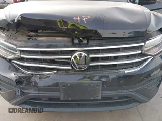 2023 Volkswagen Tiguan S z VIN 3VVRB7AX7PM036833, wystawiony jako IAAI lot #41827631 z przebiegiem 43 383 mil mil oraz . Historia ofert i sprzedaży dostępna na DreamBid. Obrazek 6.