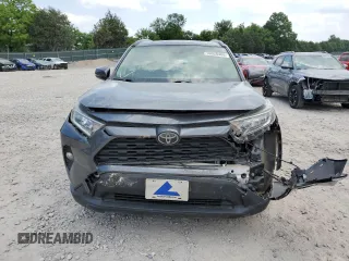 2019 Toyota RAV4 XLE with VIN JTMP1RFV8KD013125, listed as a Copart auction lot 59328465 with 106,947 mi miles and Salvage title. Bid and sale history available at DreamBid. Image 5.