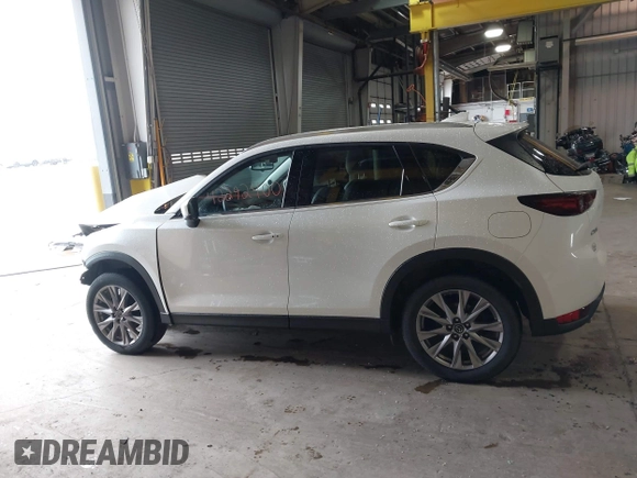 2020 Mazda CX-5 Grand Touring with VIN JM3KFADMXL0742038, listed as a IAAI auction lot 42292400 with 68,339 mi miles and . Bid and sale history available at DreamBid. Image 15.
