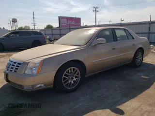 2006 Cadillac DTS 1SD z VIN 1G6KD57Y16U117113, wystawiony jako Copart lot #71485044 z przebiegiem 109 948 mil mil oraz Szkody całkowita. Historia ofert i sprzedaży dostępna na DreamBid. Obrazek 1.