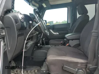 2013 Jeep Wrangler Unlimited Rubicon with VIN 1C4BJWFG5DL661282, listed as a Copart auction lot 57471035 with 128,400 mi miles and Salvage title. Bid and sale history available at DreamBid. Image 7.