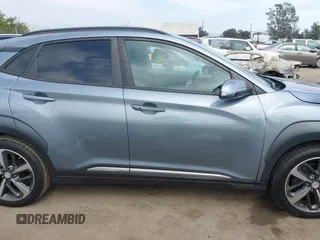 2019 Hyundai Kona Ultimate with VIN KM8K53A58KU198498, listed as a IAAI auction lot 42046679 with 57,327 mi miles and . Bid and sale history available at carsss.com. Image 14.