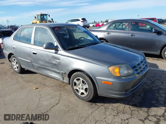 2004 Hyundai Accent GL with VIN KMHCG45C04U531177, listed as a IAAI auction lot 41526033 with 126,102 mi miles. Bid and sale history available at carsss.com. Image 1.