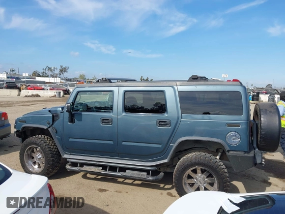 2005 Hummer H2 SUV with VIN 5GRGN23U35H105620, listed as a IAAI auction lot 41912574 with 232,938 mi miles. Bid and sale history available at carsss.com. Image 15.