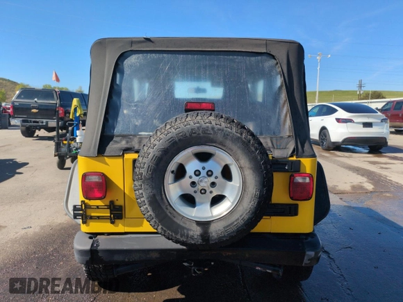 2004 Jeep Wrangler Sport z VIN 1J4FA49S64P751615, wystawiony jako Copart lot #55810895 z przebiegiem 128 165 mil mil oraz Szkoda całkowita • Salvage title. Historia ofert i sprzedaży dostępna na DreamBid. Obrazek 6.